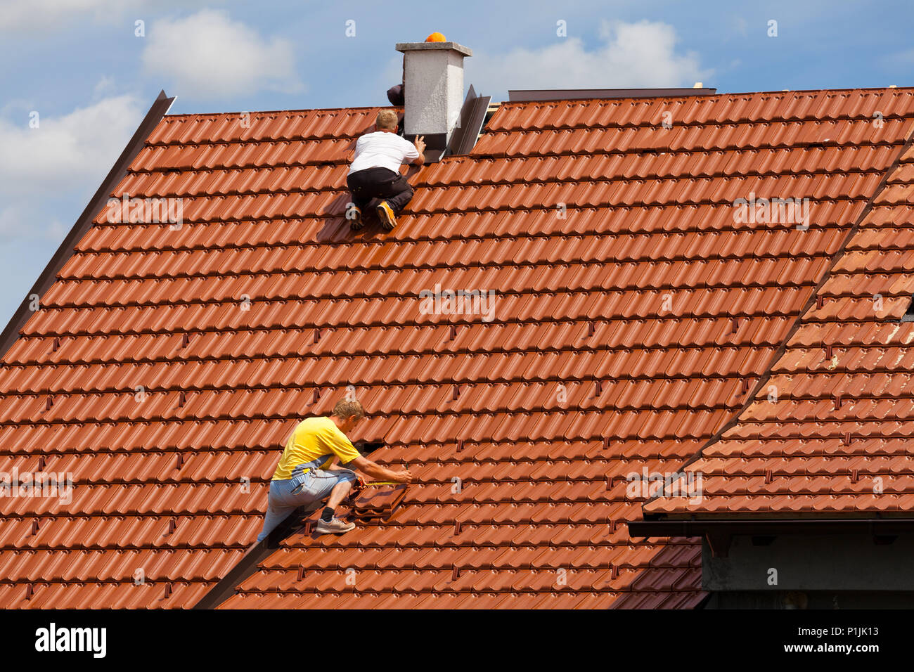 Men Working On A Roof Stock Photos Men Working On A Roof Stock