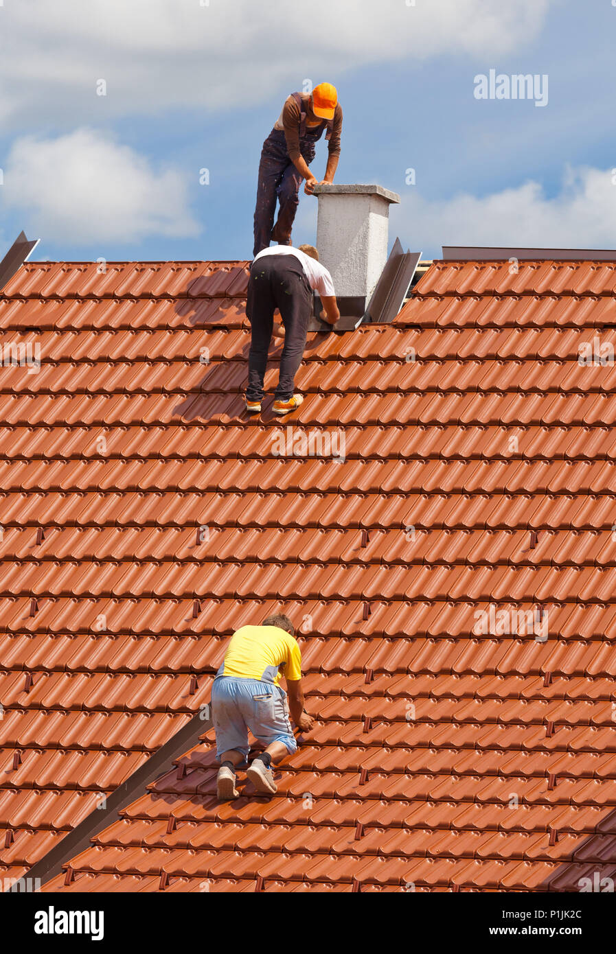 Men Working On A Roof Stock Photos Men Working On A Roof Stock