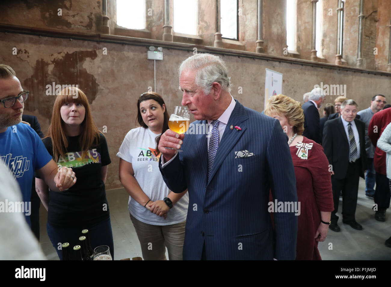 The Prince of Wales samples a special brew created for the ABVFest beer festival at Carlisle Memorial Church in Belfast where he is meeting the organisations involved in the regeneration of the building, which hosts the festival. Stock Photo