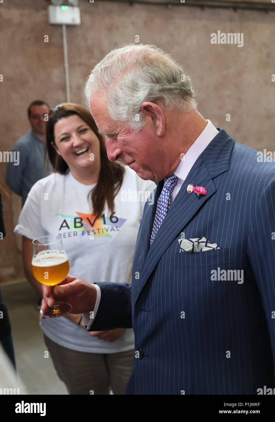 The Prince of Wales samples a special brew created for the ABVFest beer festival at Carlisle Memorial Church in Belfast where he is meeting the organisations involved in the regeneration of the building, which hosts the festival. Stock Photo