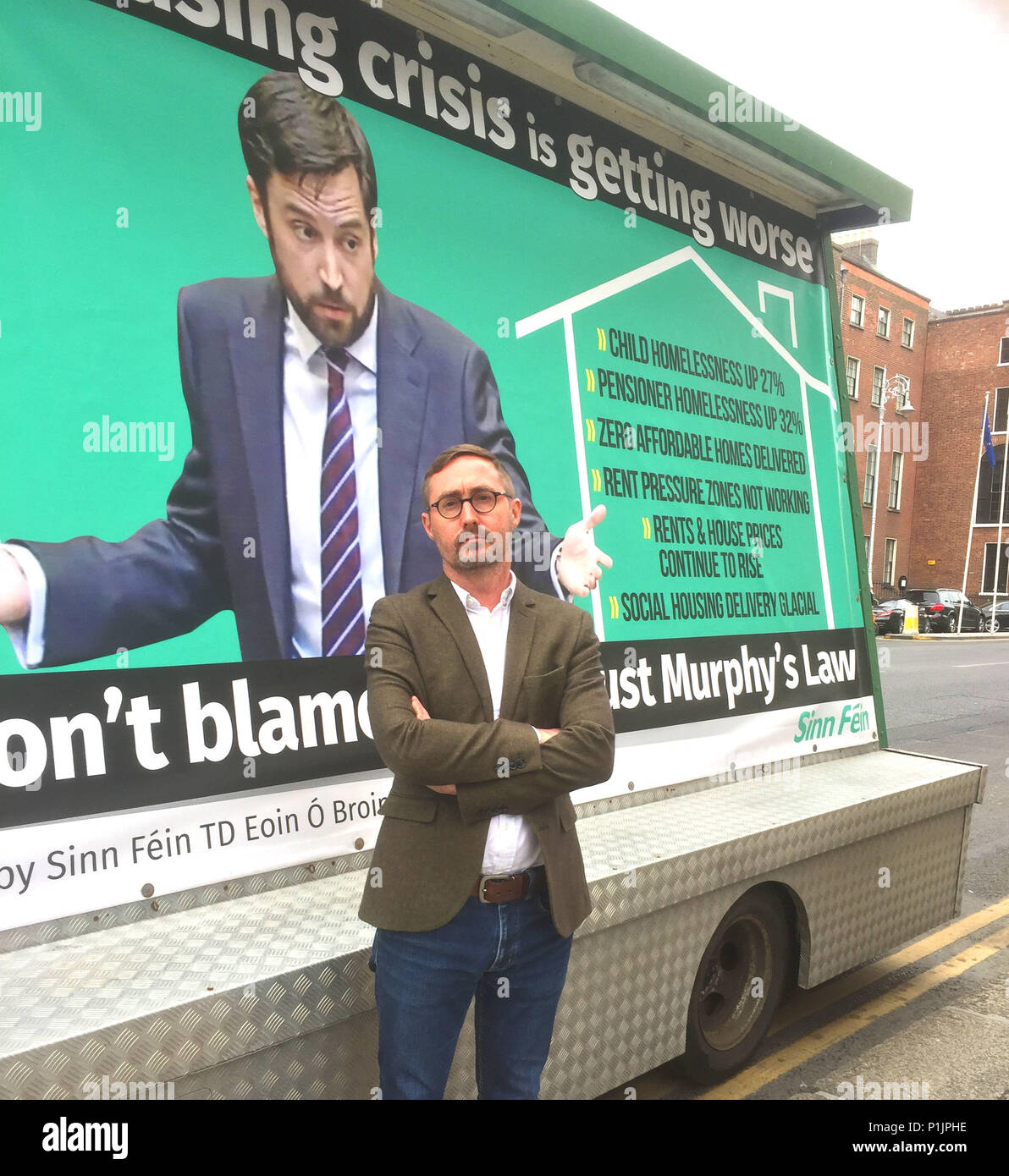 Sinn Fein housing spokesman Eoin O Broin marked Eoghan Murphy's first year as Ireland's Minister for Housing with a mobile billboard outside government buildings in Dublin, highlighting the department's failings and how the housing crisis is getting worse under his watch. Stock Photo