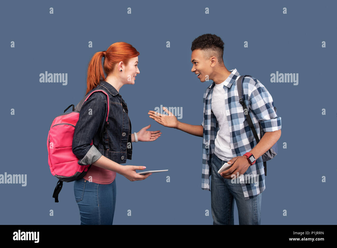 Joyful positive people looking at each other Stock Photo