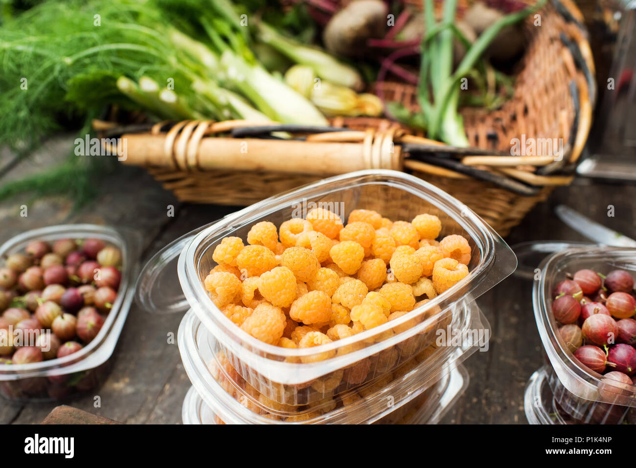 Yellow raspberries on farmer table in a market gardening concept Stock Photo