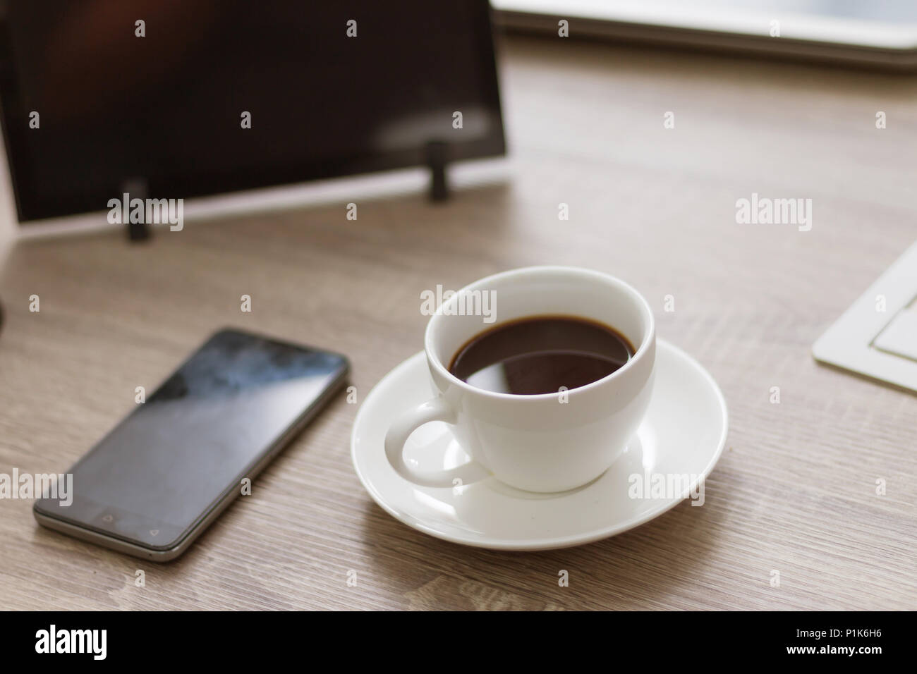 Coffee Cup On Wooden Table With Tablet Laptop Computer And Smartphone 