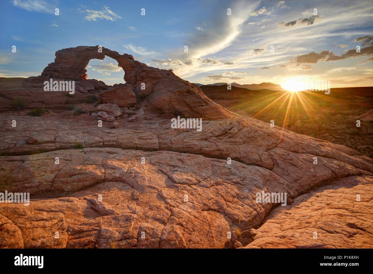 Sunset over Arsenic Arch, San Rafael Desert near Hanksville, Utah, United States Stock Photo