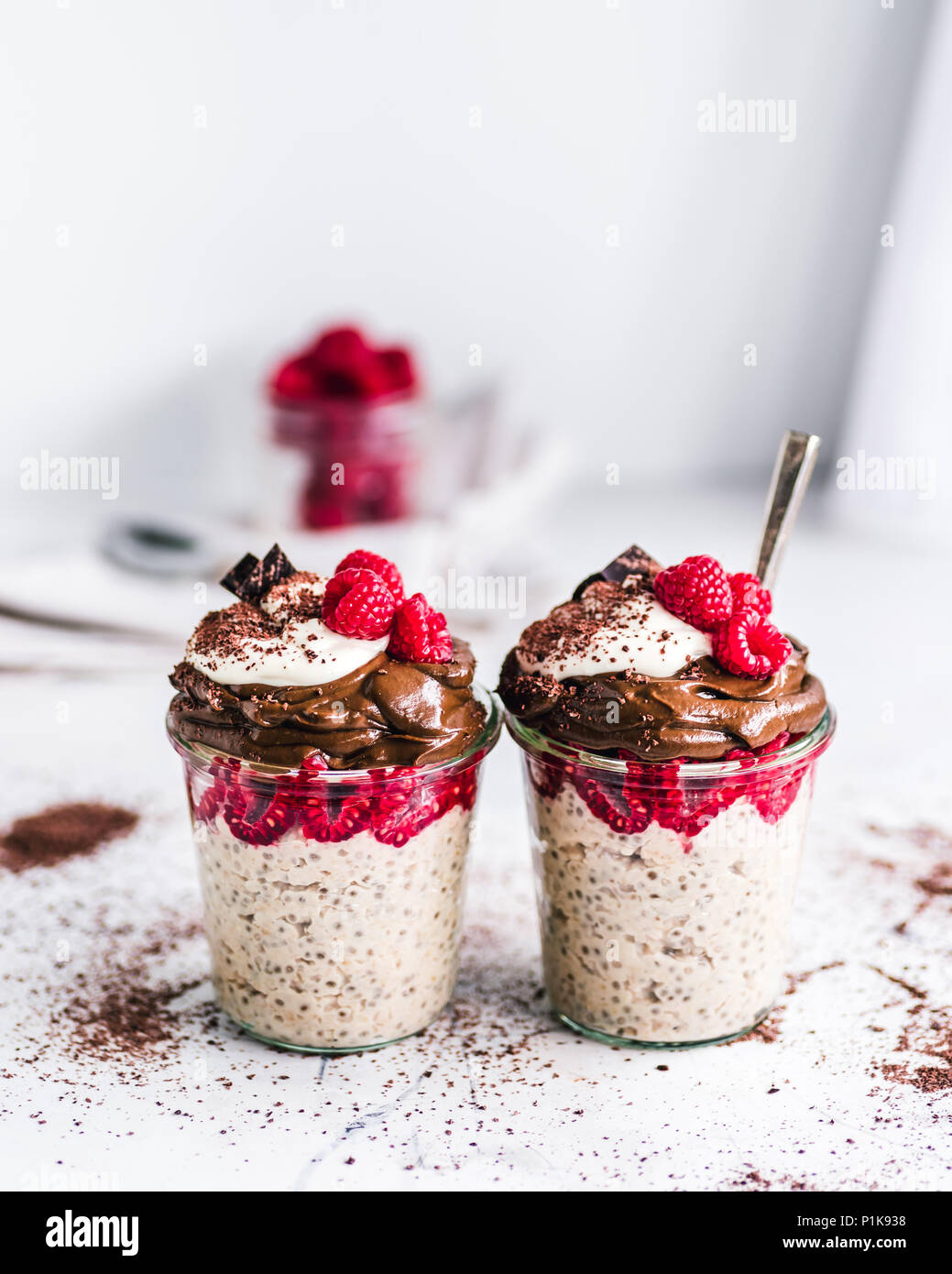 Peanut Butter Chia Oatmeal Topped With Chocolate Avocado Mousse Coconut Yogurt And Raspberries Stock Photo Alamy
