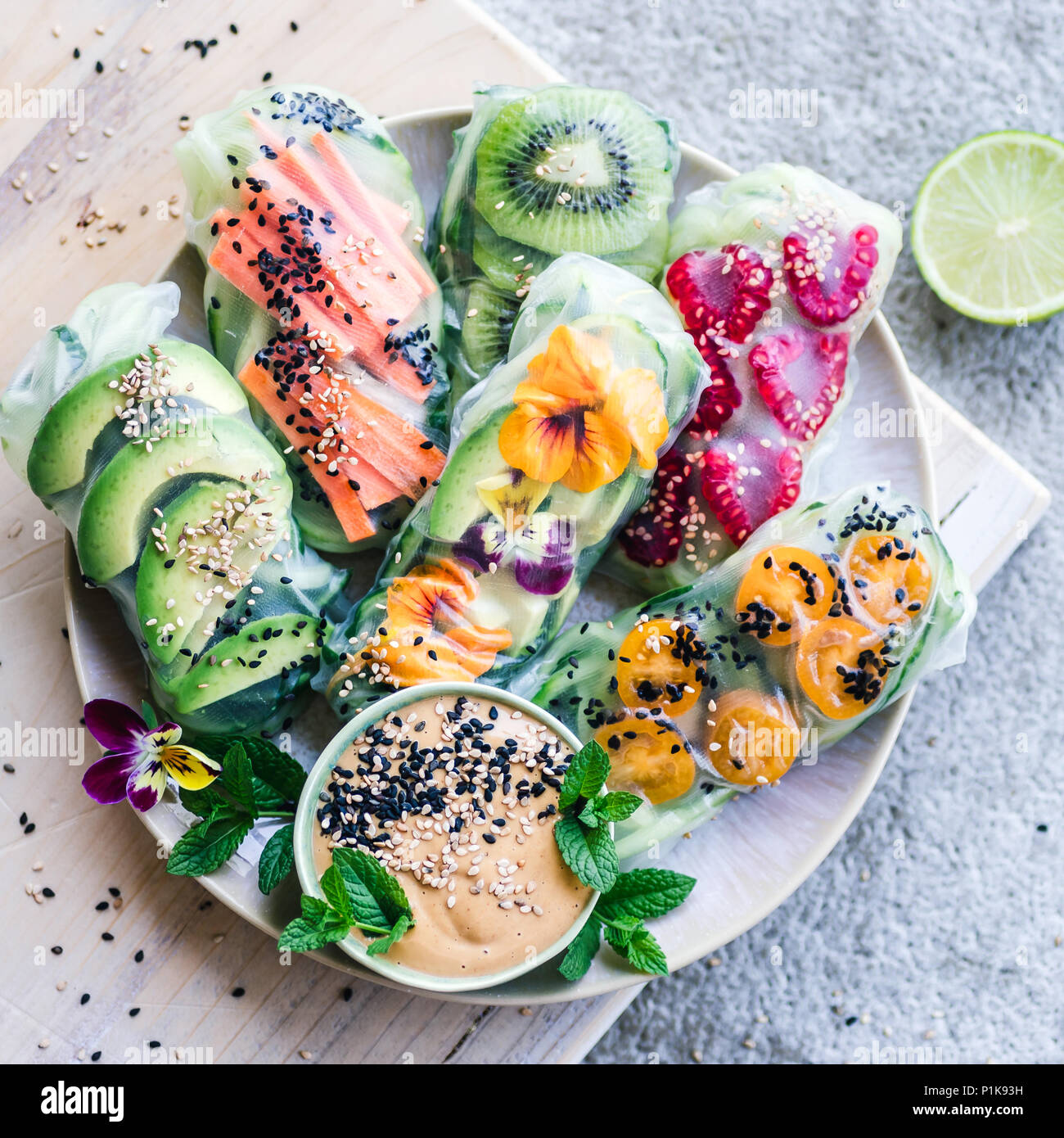 Fruit and vegetable spring rolls with peanut butter dip Stock Photo Alamy