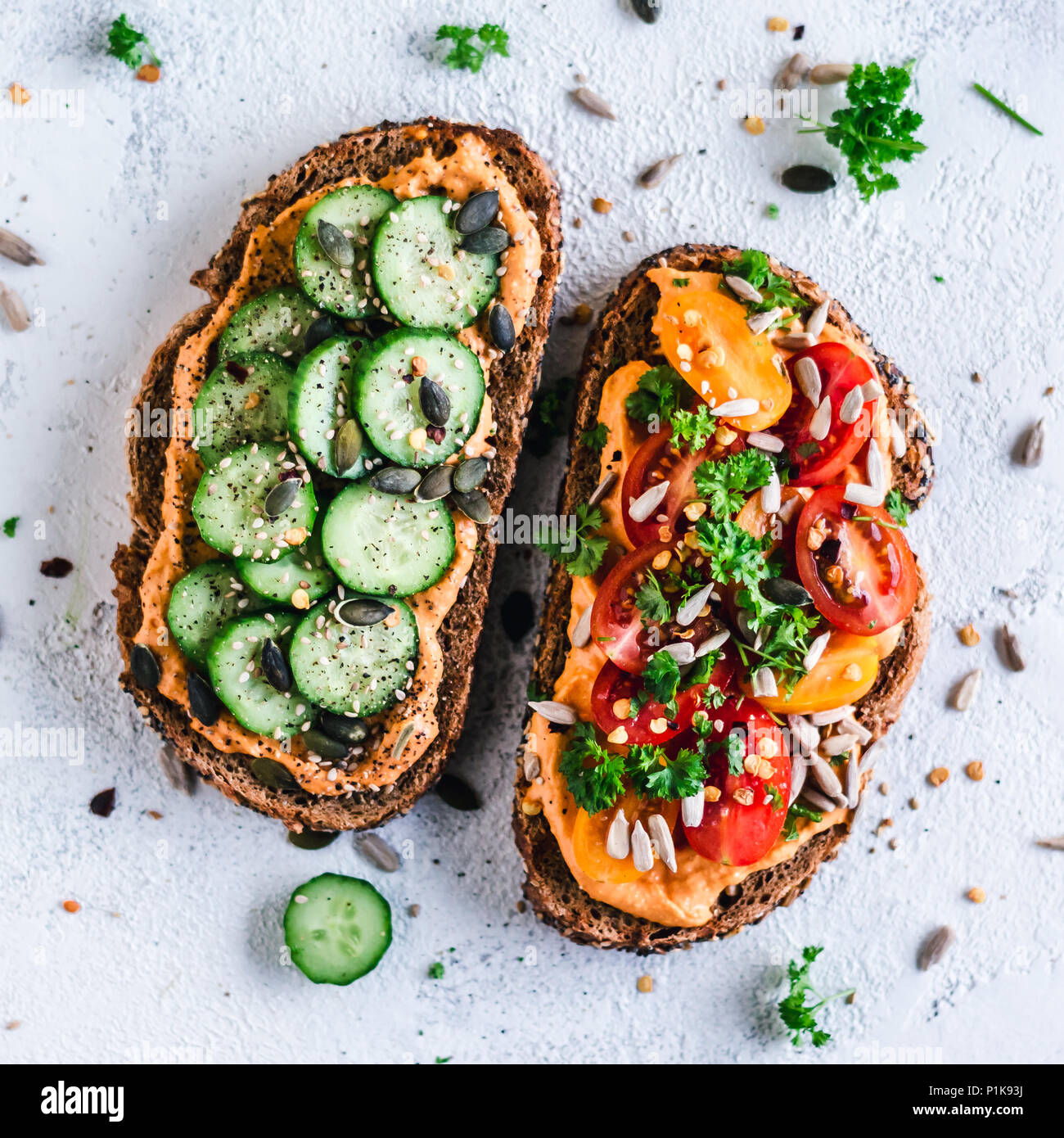 Paprika Hummus toasts with tomato and cucumber Stock Photo Alamy