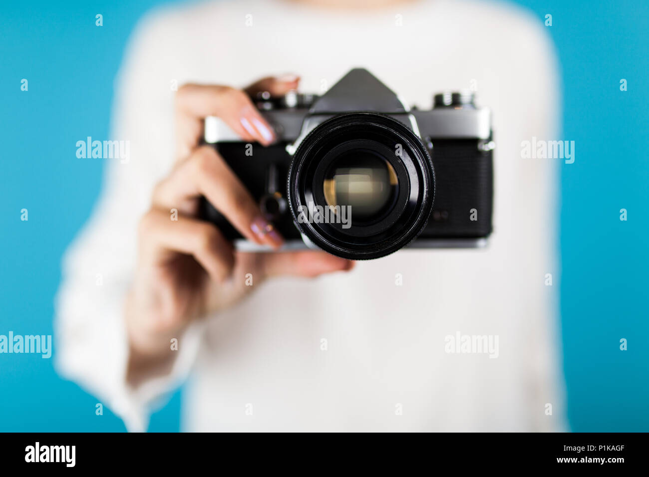 Young woman holding a film photo camera Stock Photo - Alamy