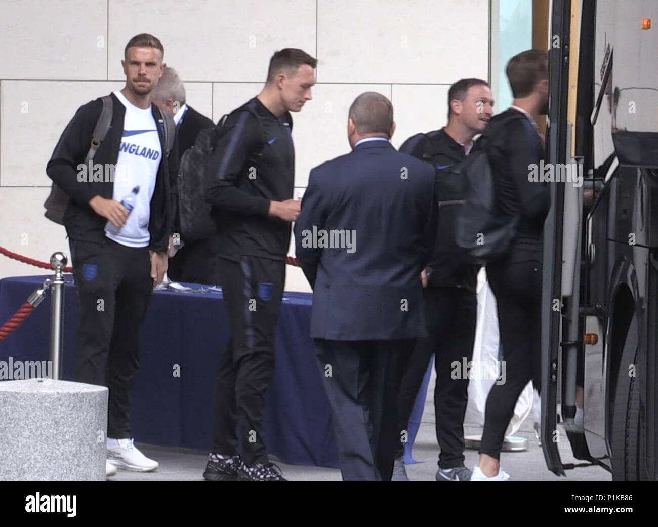 England's Jordan Henderson (left) and Phil Jones (second left) prepare to board the bus at St George's Park in Burton ahead of flying out to Russia for the 2018 FIFA World Cup. Stock Photo