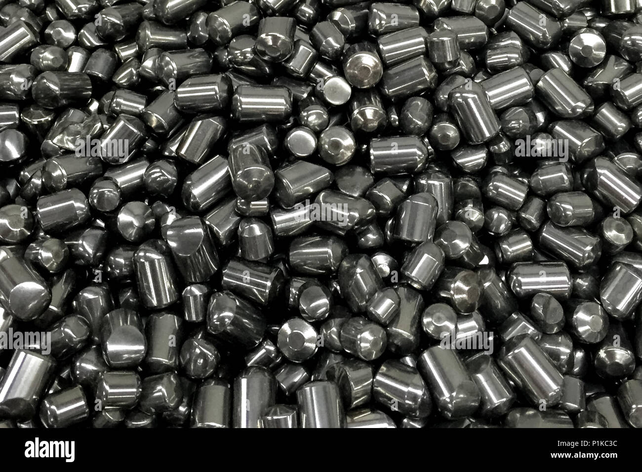 Tungsten cylinders. Ingots of tungsten in a pile Stock Photo Alamy