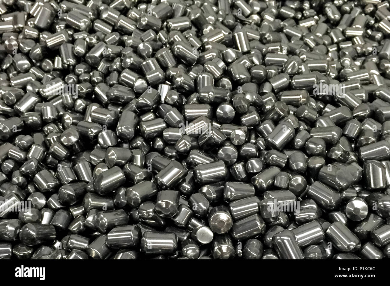 Tungsten cylinders. Ingots of tungsten in a pile Stock Photo Alamy