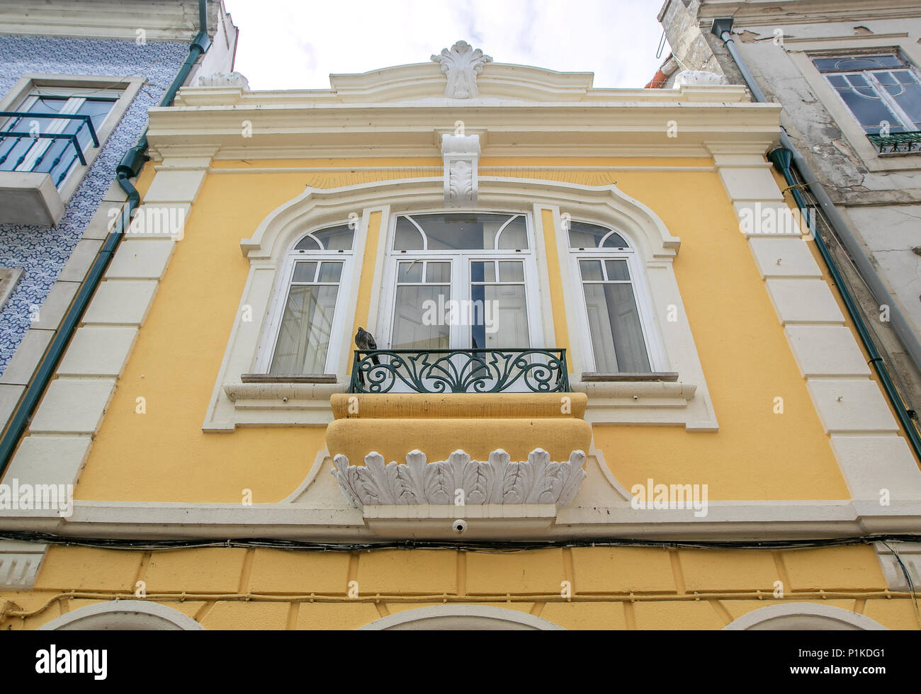 Beautiful yellow building with a balcony in the  historic part of Aveiro, Portugal. Stock Photo