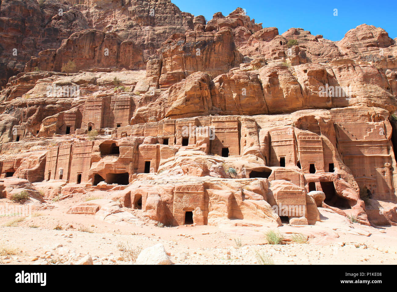 Street of Facades, riddling the walls of the Outer Siq are over 40 tombs and houses built by the Nabataeans. Ancient city of Petra, Jordan. It is now  Stock Photo
