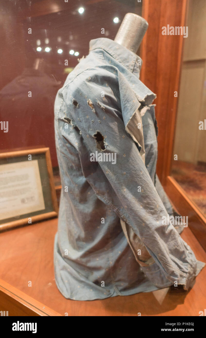Shirt worn by Clyde Barrow one half of infamous Bonnie & Clyde duo with bullet holes from the shoot out in 1934 Stock Photo