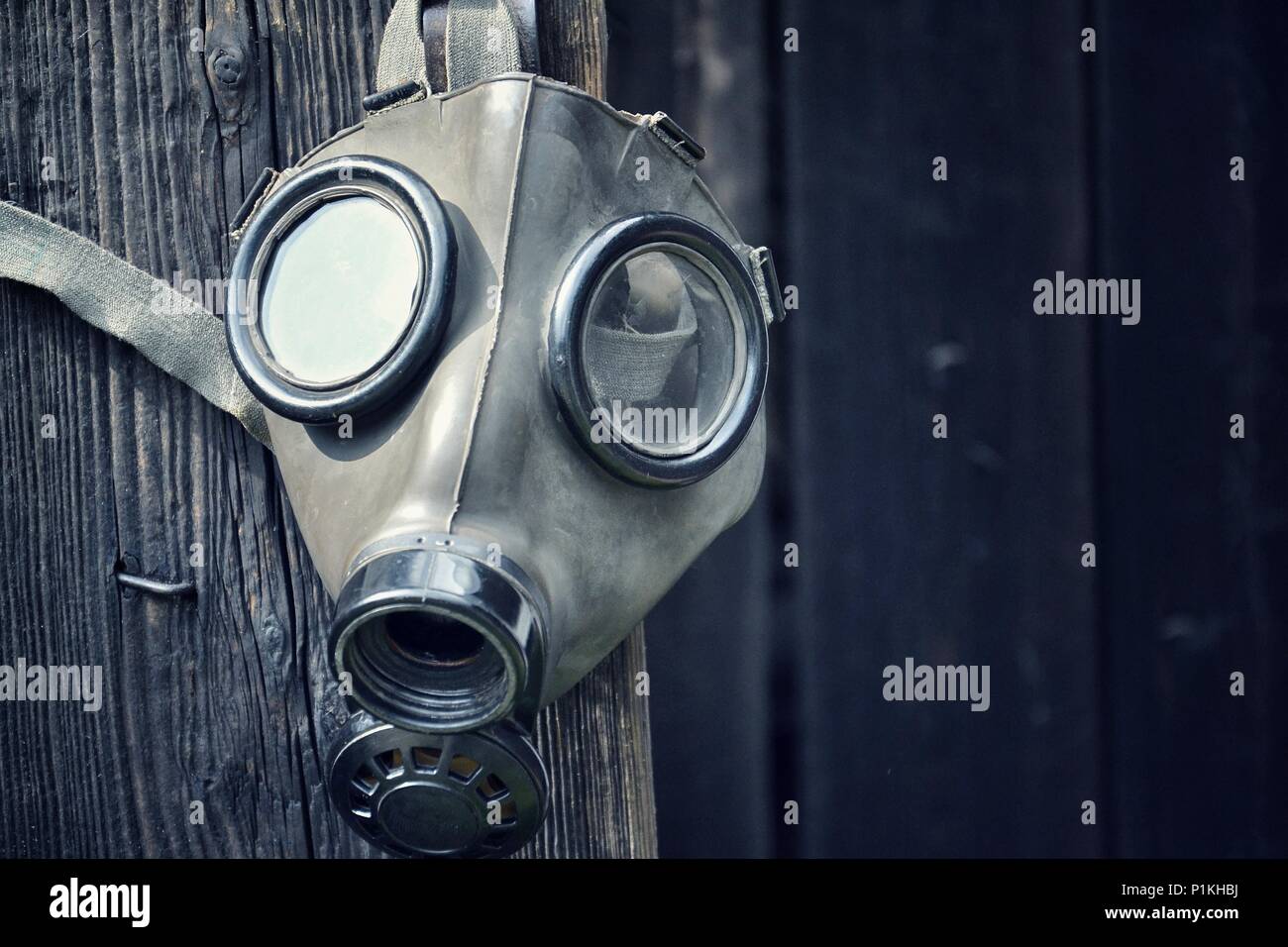 Old gas mask on wooden background, terrorism pollution apocalypse concept  Stock Photo - Alamy