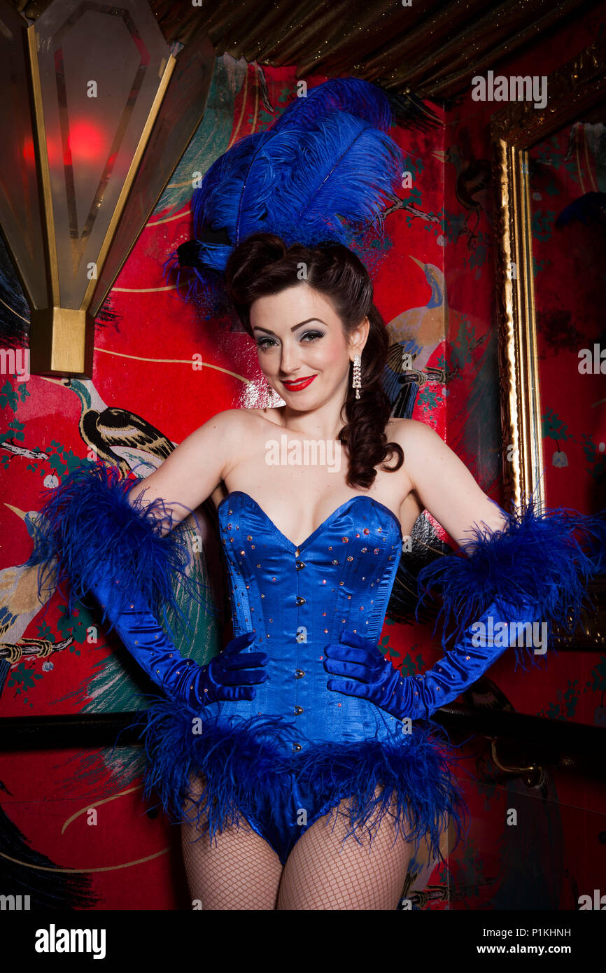 Burlesque performer Polly Rae at Madame Jojos, wearing blue feather head  dress and blue corset, London Stock Photo - Alamy