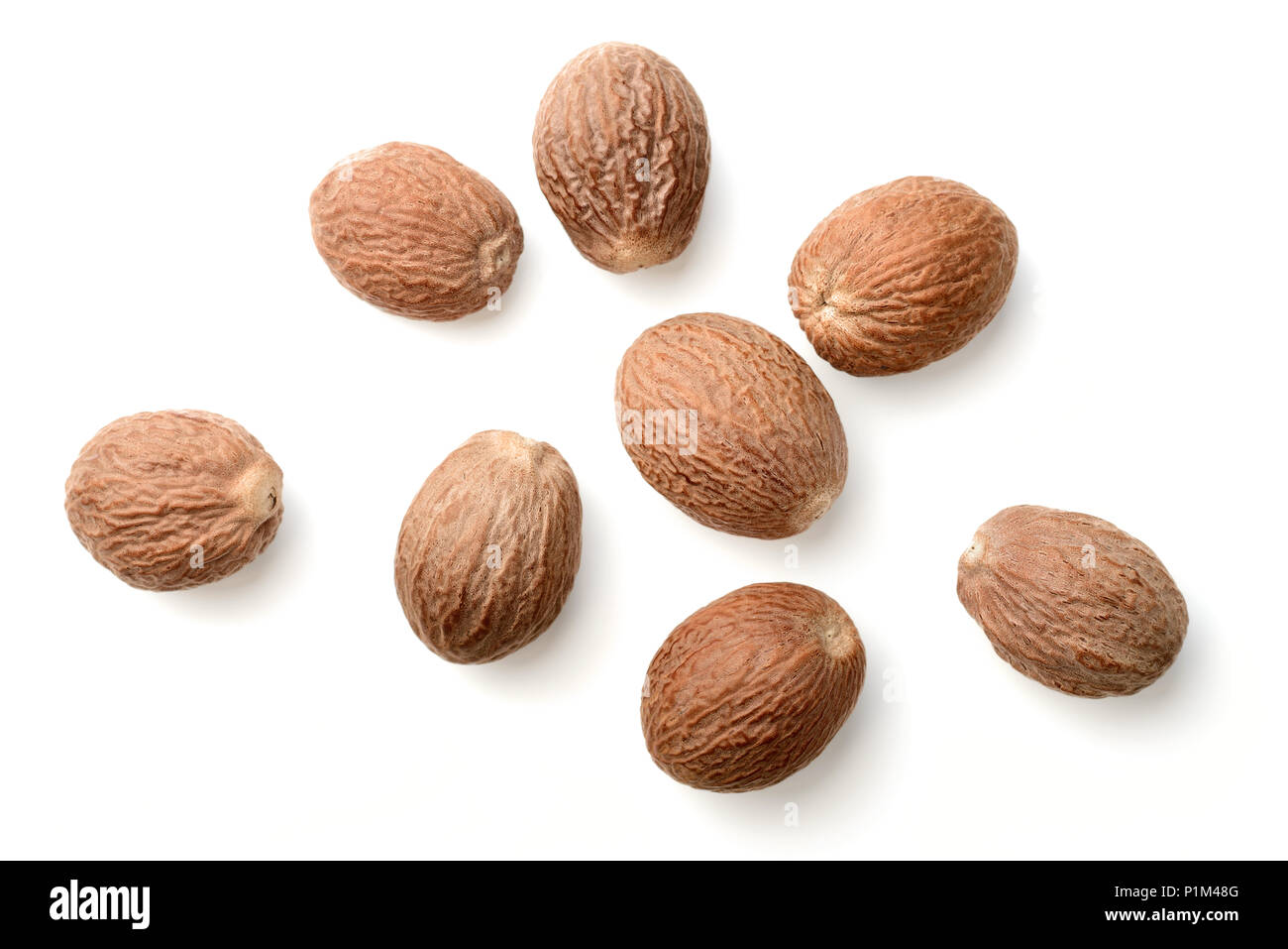 dried nutmeg isolated on the white background Stock Photo - Alamy