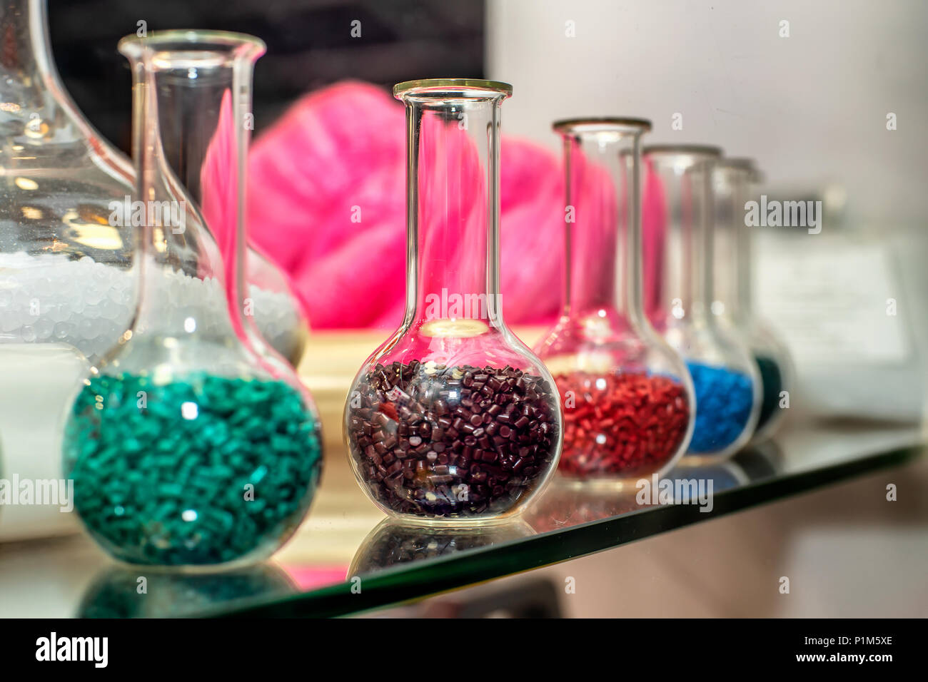 Polymeric dye. Plastic pellets. Colorant for plastics. Pigment in the granules. Polymer beads Stock Photo