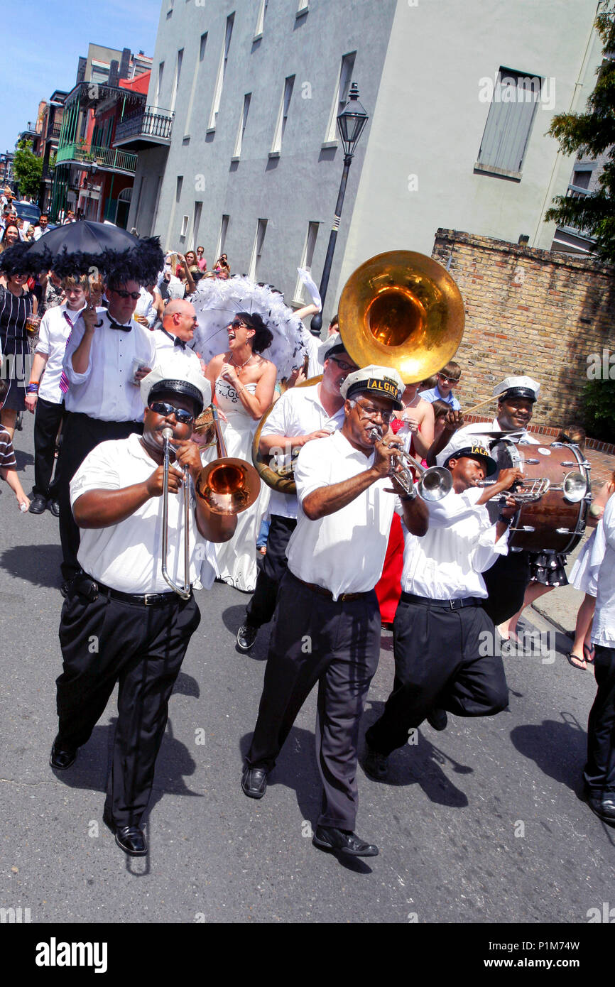 Algiers Brass Band and a wedding procession / parade, French Quarter, New Orleans, Louisiana, USA Stock Photo