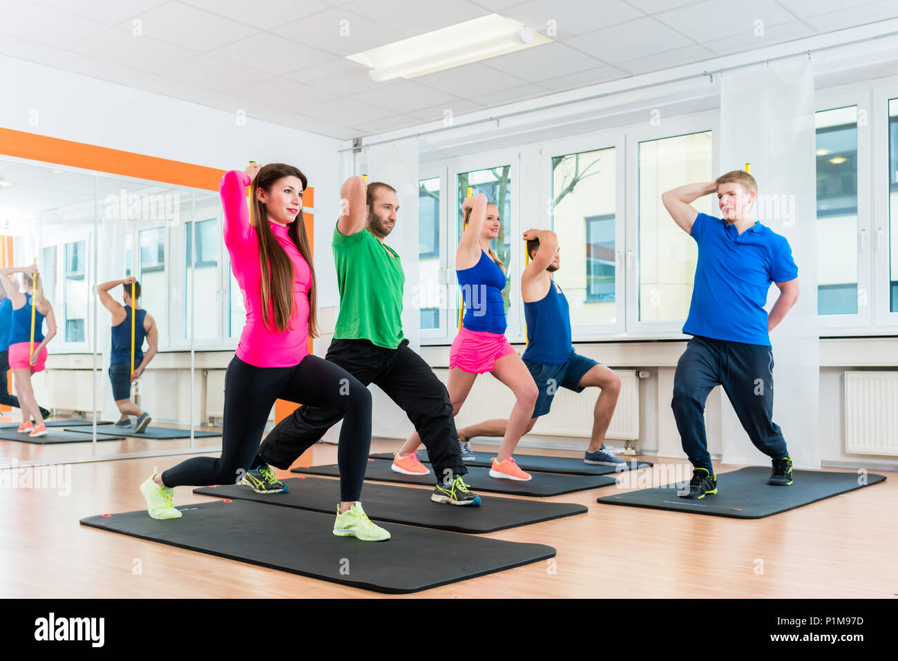 Young athletes doing gymnastics in health club gym Stock Photo - Alamy
