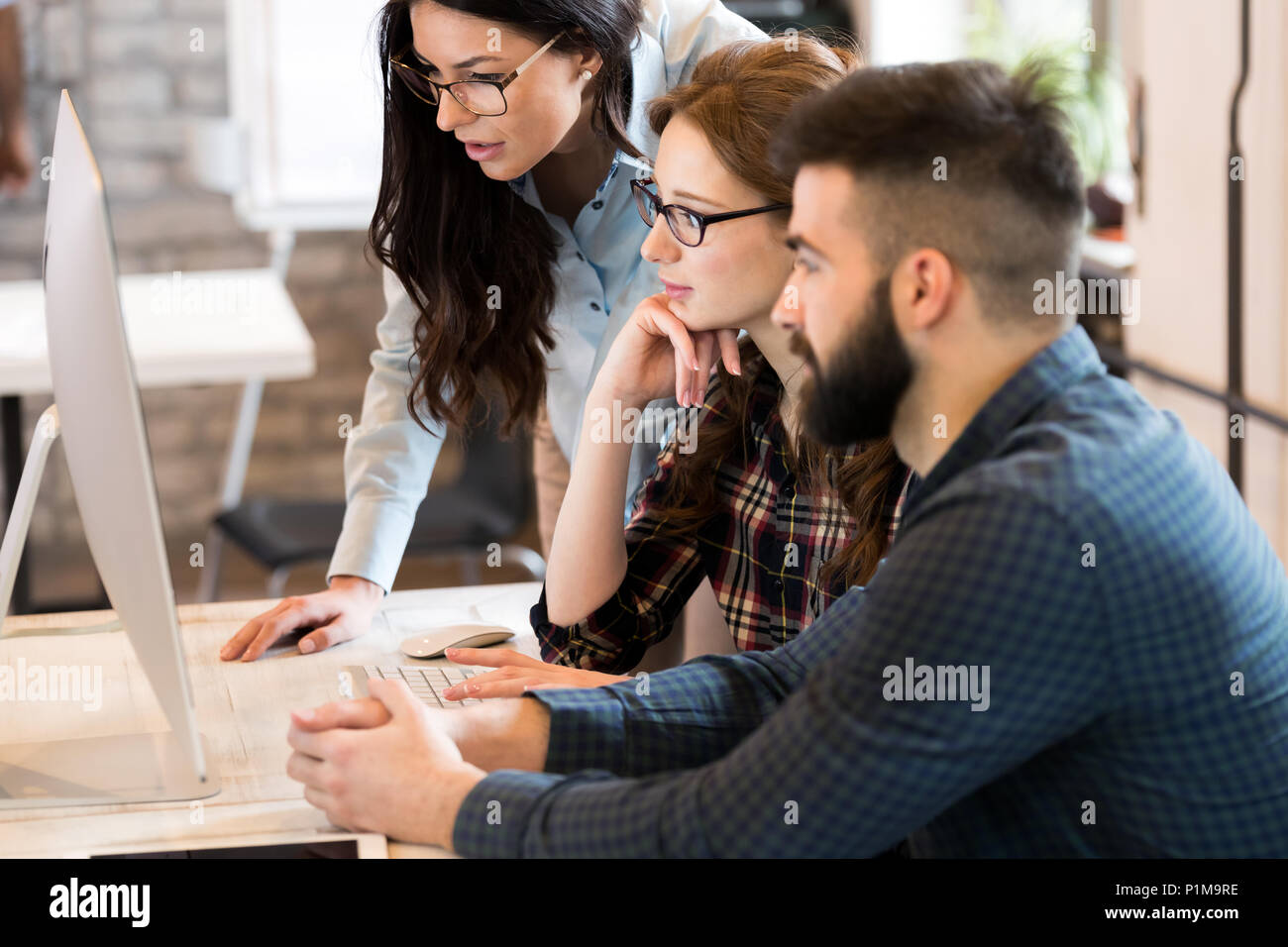 Young architects working on project in office Stock Photo