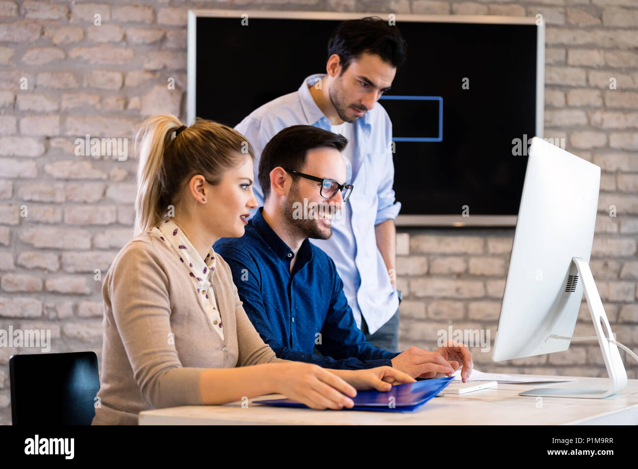 Young architects working on project in office Stock Photo