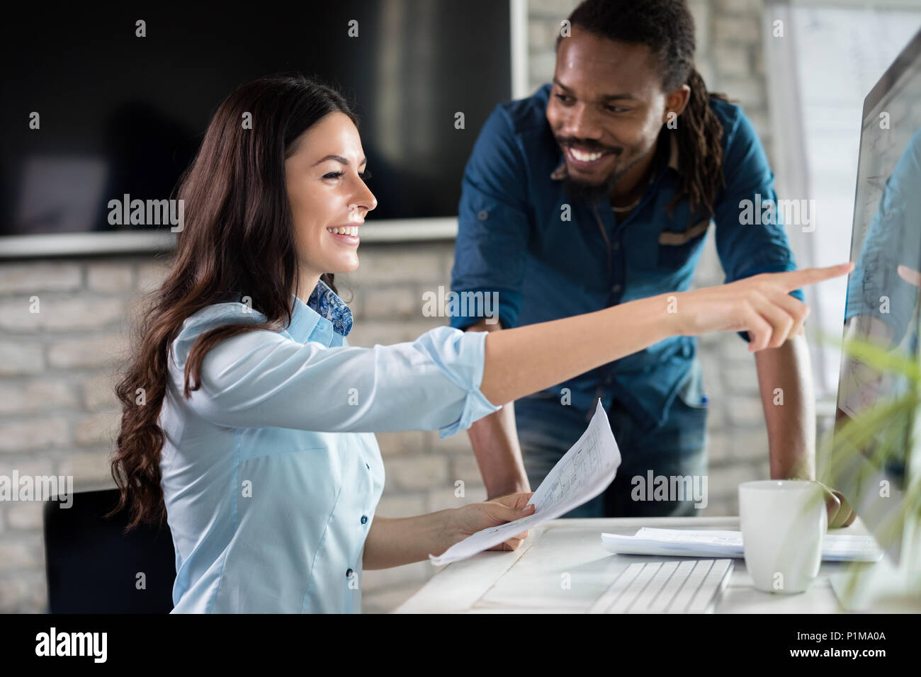 Young architects working on project in office Stock Photo