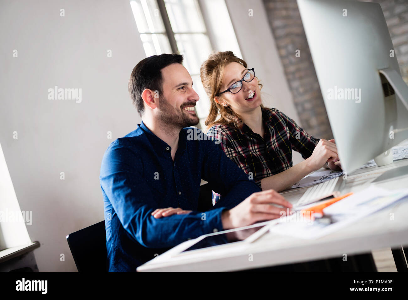 Young architects working on project in office Stock Photo