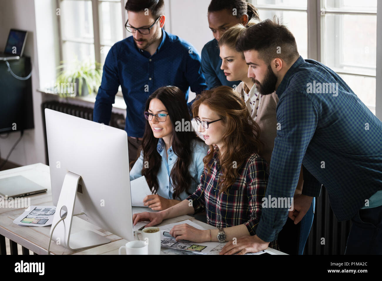 Young architects working on project in office Stock Photo