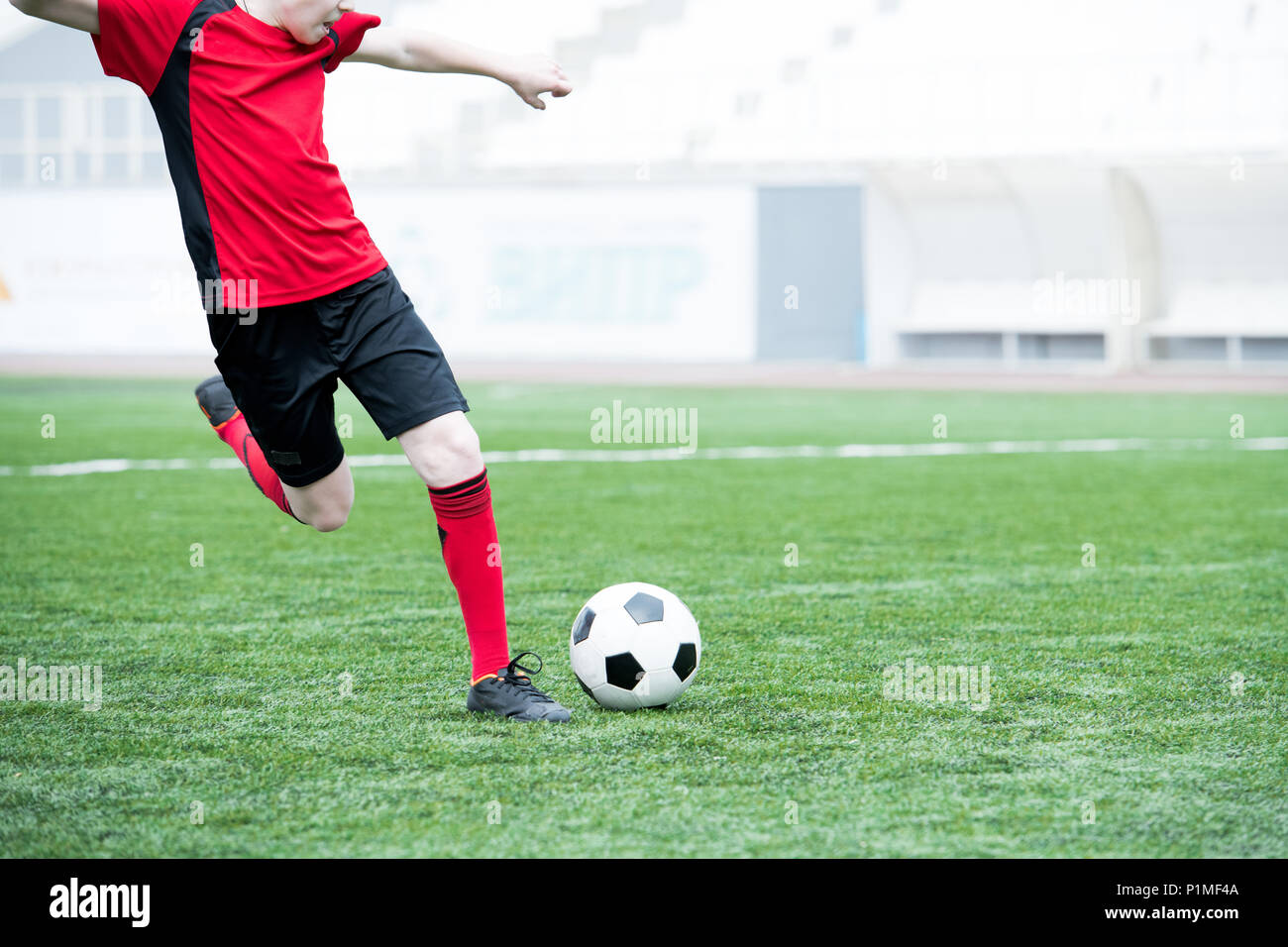Football Player Kicking Ball Stock Photo Alamy