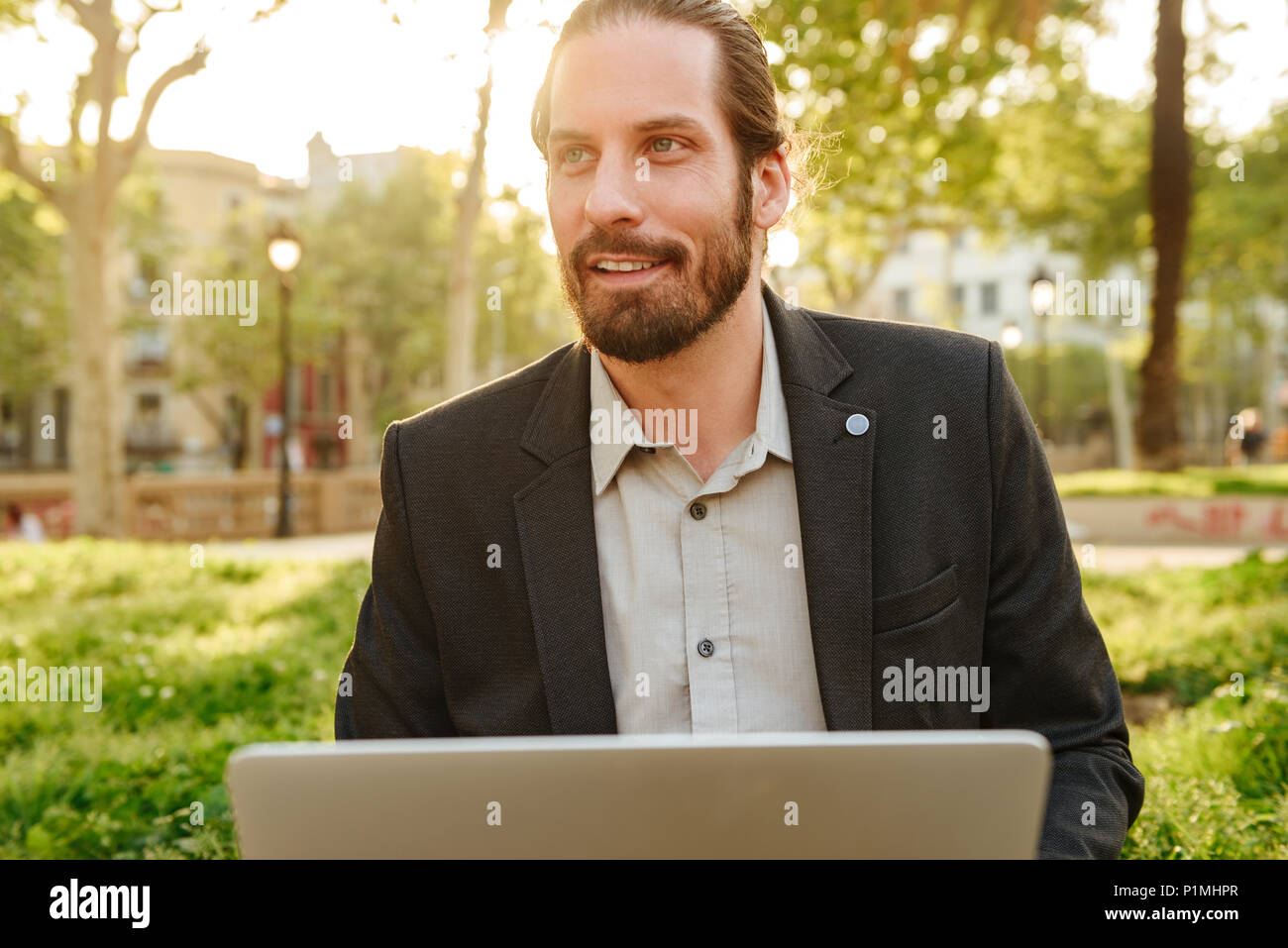Picture Closeup Of Businesslike Handsome Man With Tied Hair