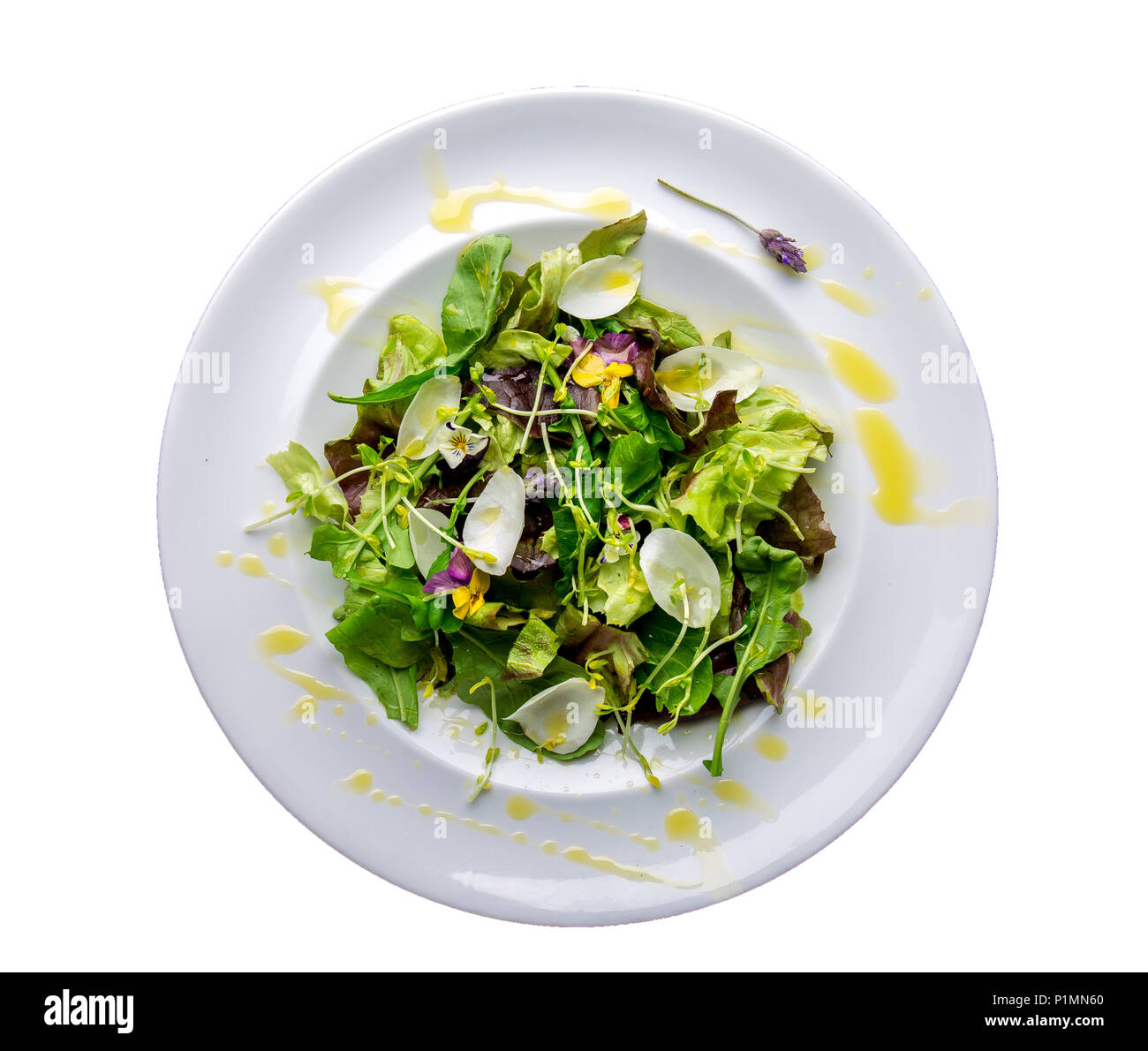 Healthy lettuce arugula salad with edible flowers and microgreens on
