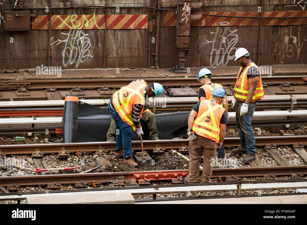 126th Street New York USA. Railroad workers working on the track. 2018 Stock Photo