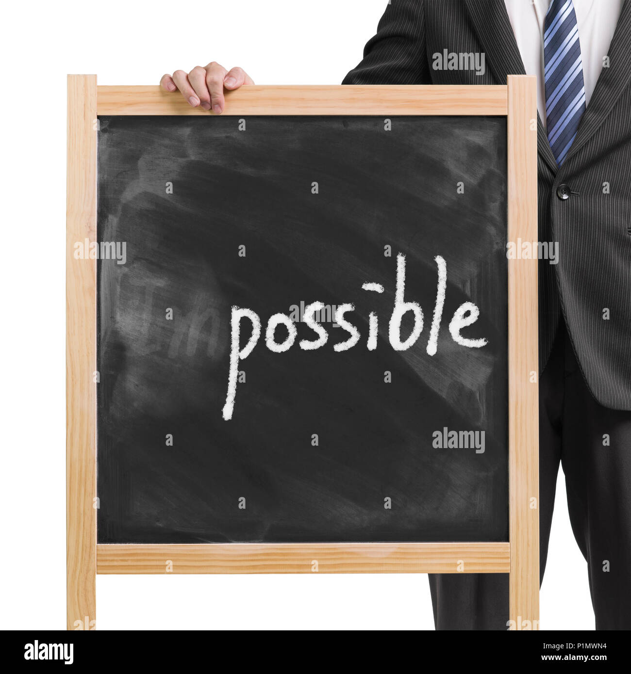 Businessman hold dirty wooden chalk board with word "impossible ...