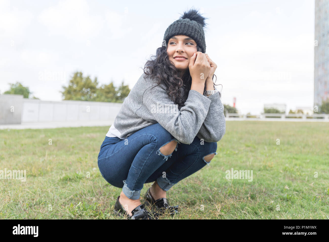 One young woman beach thinking wool hi-res stock photography and images ...