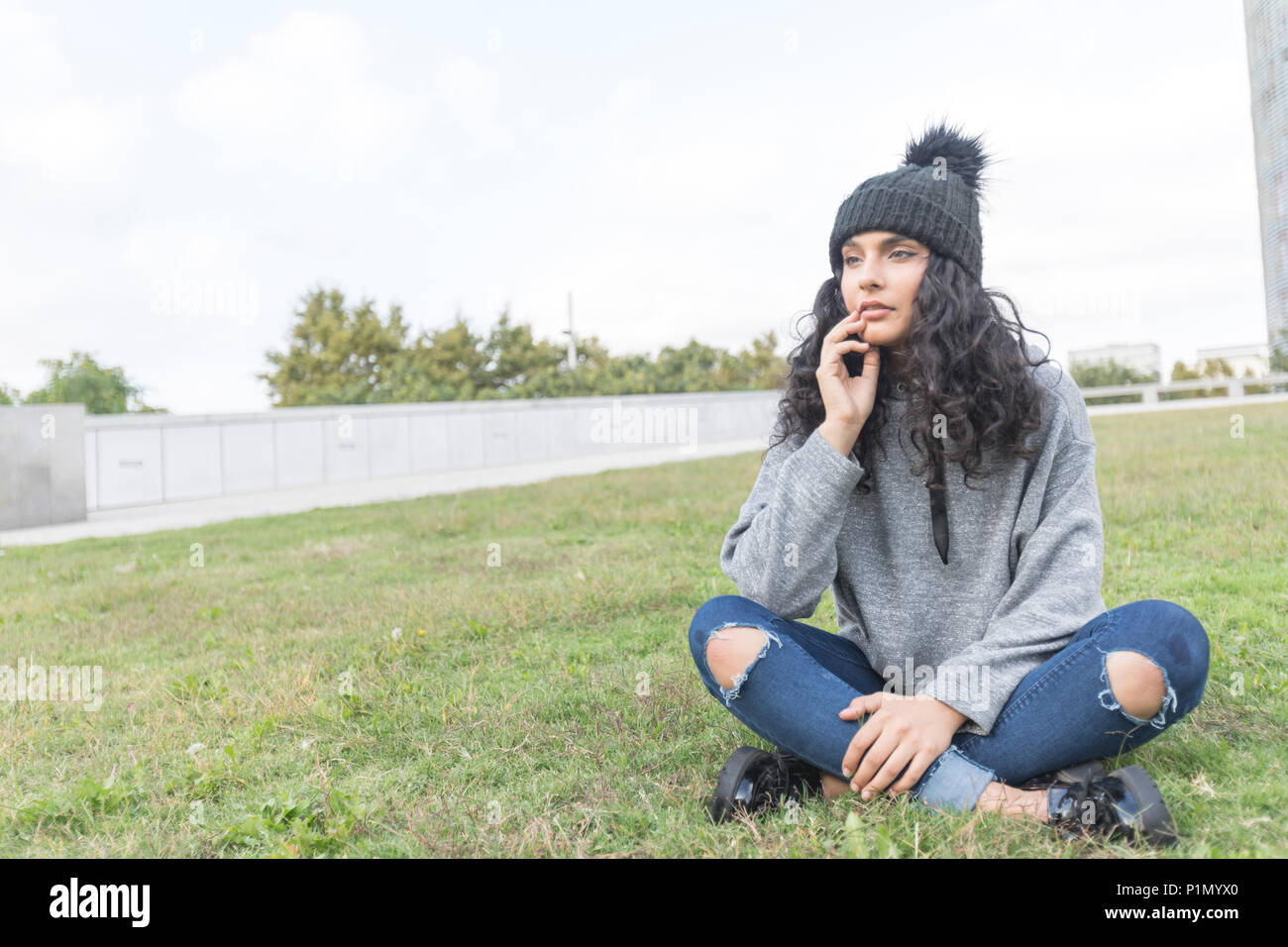 One young woman beach thinking wool hi-res stock photography and images ...