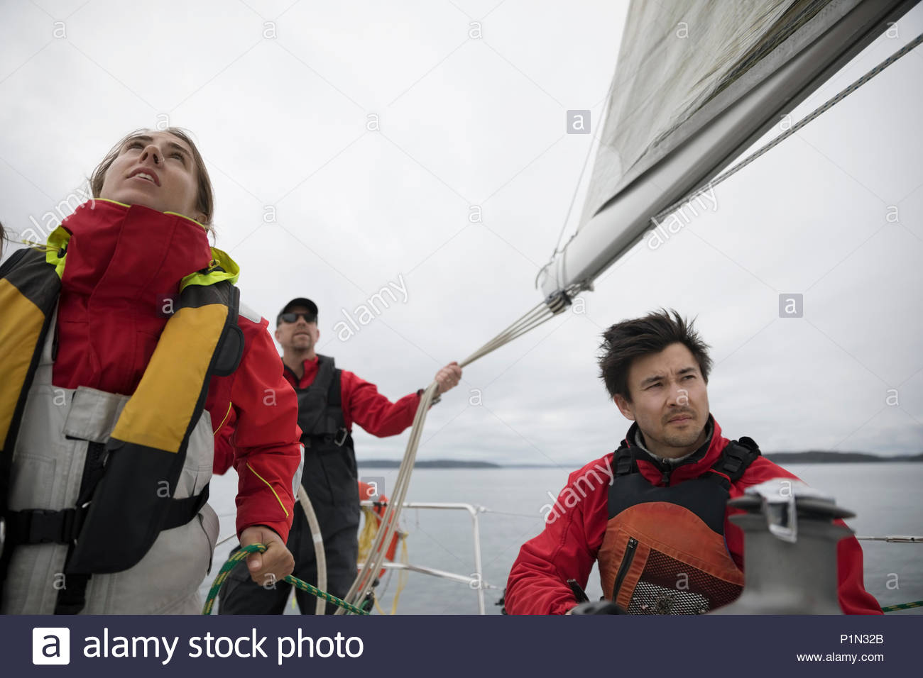 Sailing team training on sailboat on ocean Stock Photo Alamy