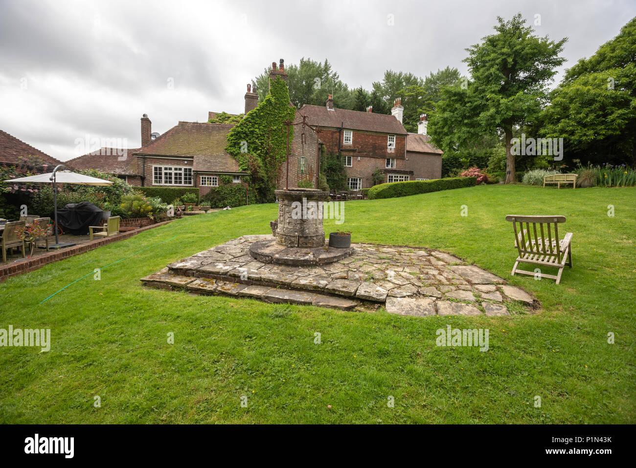 Water well in the middle of a garden in a period house in Burwash, Etchingham, East Sussex