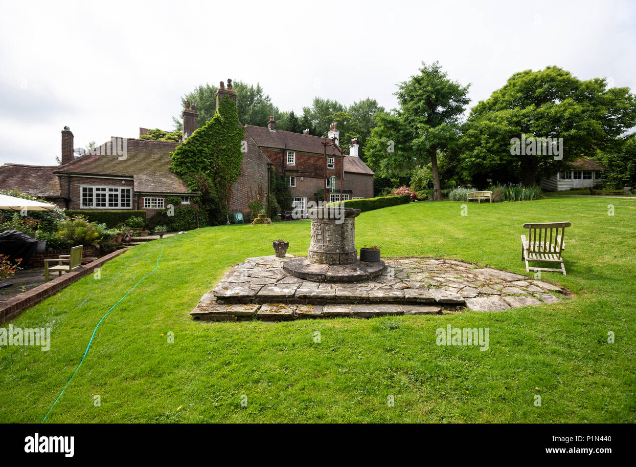 Water well in the middle of a garden in a period house in Burwash
