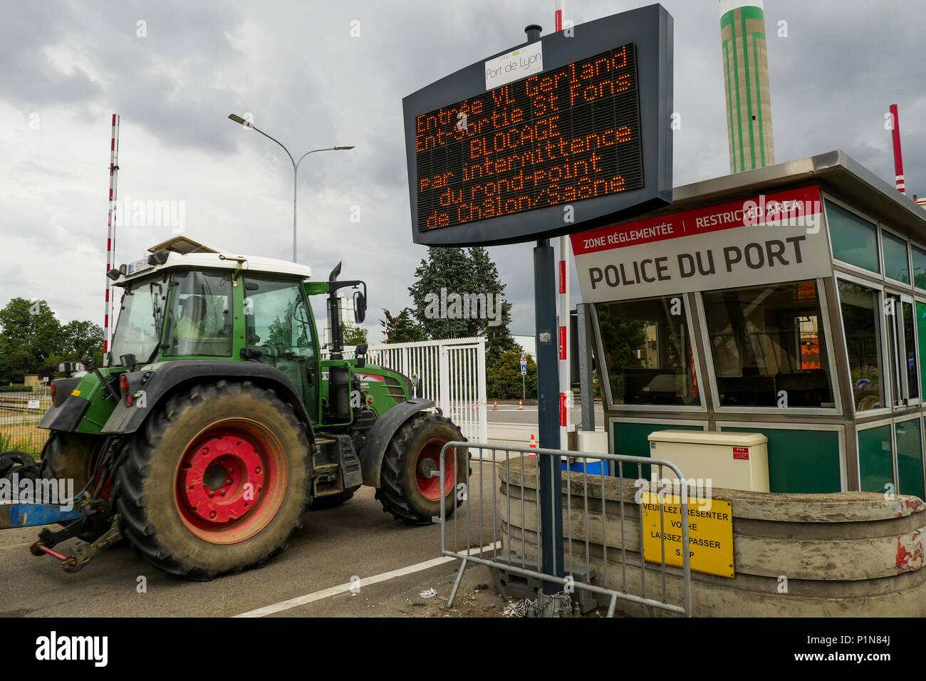 Lyon, France, 12th June 2018: Farmers, members of FNSEA and Jeunes Agriculteurs (in english, Young Farmers) are seen in Lyon (Central-Eastern France) as they take part, for the second day, in the blockade of the fuel tanks at Edouard Herriot industrial harbor, to protest against both the revision of European financial aid and  the massive importation of palm oil by Total petroleum company. This action was part of a national movement of blockade concerning different refineries and fuel depots for a three days long period. Credit photo : Serge Mouraret/Alamy Live News Stock Photo