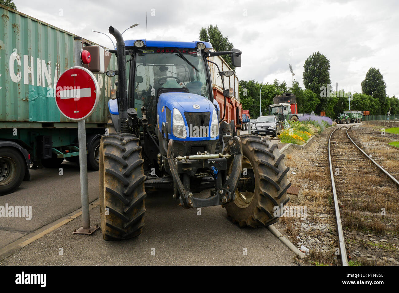 Lyon, France, 12th June 2018: Farmers, members of FNSEA and Jeunes Agriculteurs (in english, Young Farmers) are seen in Lyon (Central-Eastern France) as they take part, for the second day, in the blockade of the fuel tanks at Edouard Herriot industrial harbor, to protest against both the revision of European financial aid and  the massive importation of palm oil by Total petroleum company. This action was part of a national movement of blockade concerning different refineries and fuel depots for a three days long period. Credit photo : Serge Mouraret/Alamy Live News Stock Photo
