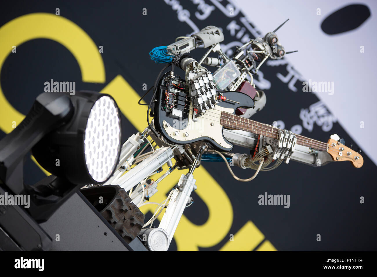 Hannover, Germany. 12th June, 2018. Robot band Compressorhead (here robot Bones, bass) - based in Berlin and playing on real musical instruments - is performing live at CEBIT 2018, international computer expo and Europe's Business Festival for Innovation and Digitization. Credit: Christian Lademann / Alamy Live News Stock Photo