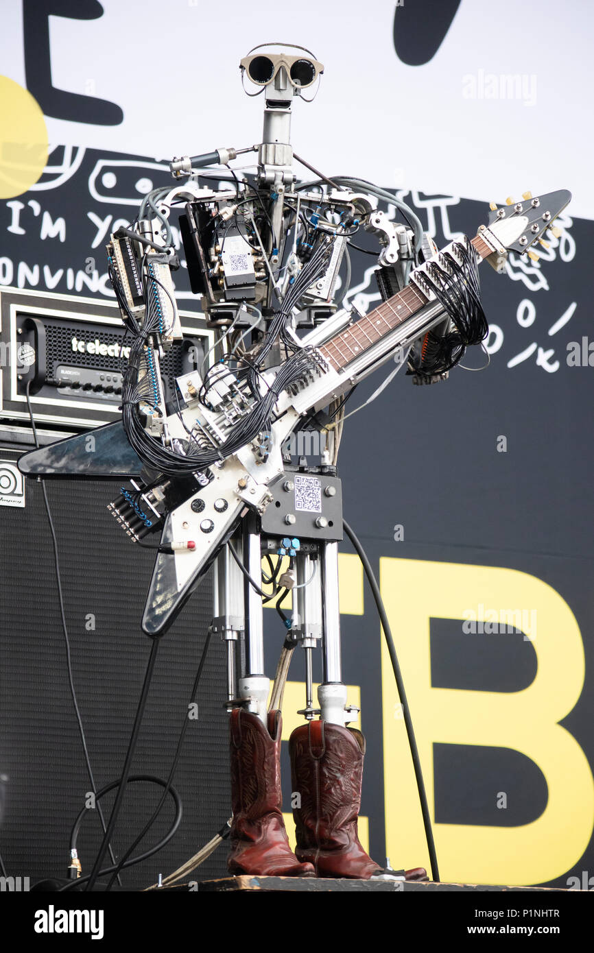 Hannover, Germany. 12th June, 2018. Robot band Compressorhead (here robot Fingers, guitar) - based in Berlin and playing on real musical instruments - is performing live at CEBIT 2018, international computer expo and Europe's Business Festival for Innovation and Digitization. Credit: Christian Lademann / Alamy Live News Stock Photo