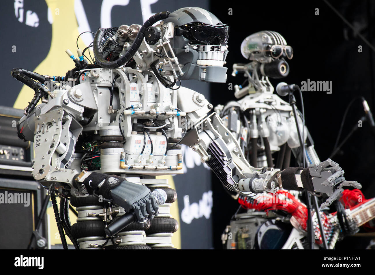 Hannover, Germany. 12th June, 2018. Robot band Compressorhead (here robots  Mega-Wattson and Hellga Tarr) - based in Berlin and playing on real musical  instruments - is performing live at CEBIT 2018, international