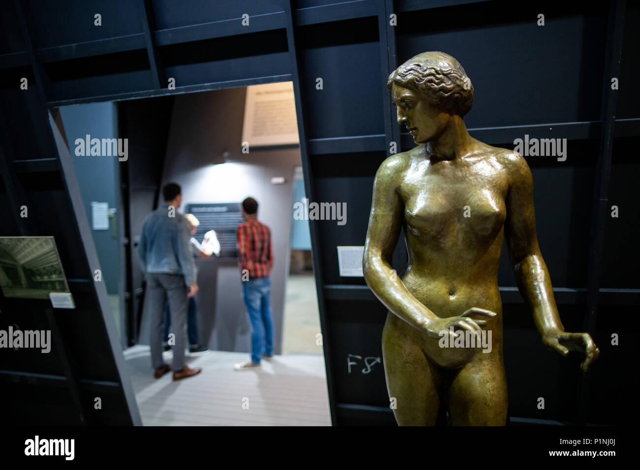 13 June 2018, Nuremberg, Germany: A life sized bronze figure from 1935 by sculptor Hanna Cauer can be seen at the exhibition 'Hitler.Macht.Oper · Propaganda und Musiktheater in Nürnberg' (lit. 'Propaganda and Musical Theatre in Nuremberg') at the Documentation Center Nazi Party Rally Grounds. The exhibition will be shown between the 15th of June 2018 and the 3rd of February 2019. It documents the role of musical theatre in National Socialist propaganda. Photo: Daniel Karmann/dpa Stock Photo