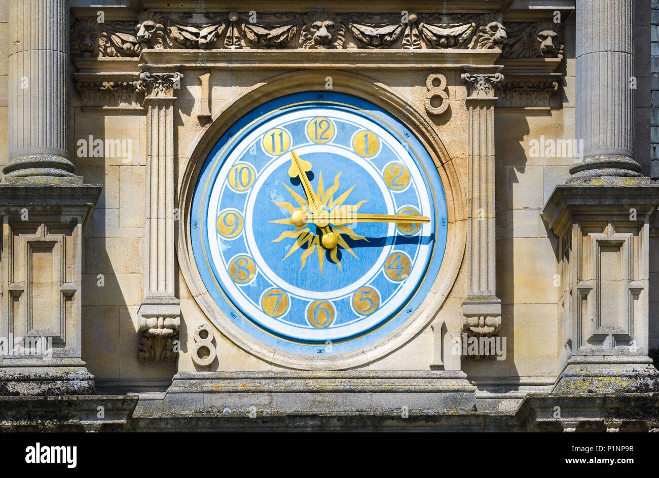 Clock on the wall of the Examinations School at the university of Oxford, England. Stock Photo