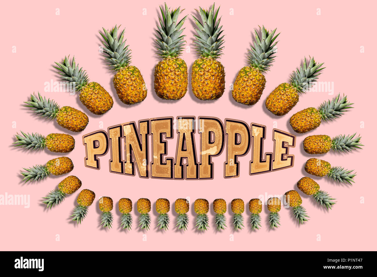 Pineapple photomontage with whole pineapples and drop shadow of varying size surrounding text 'Pineapple' on light pink background. Stock Photo