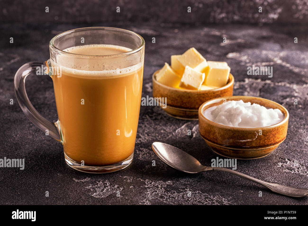Bulletproof coffee, blended with organic  butter and MCT coconut oil, paleo, keto, ketogenic drink breakfast. Stock Photo