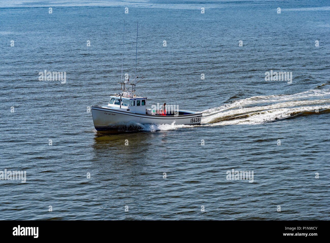 Lobster boat coming out of Caribou, Nova Scotia, Canada. Photo taken from the Woods Island, P.E.I. to Caribou, N.S. Ferry. Stock Photo